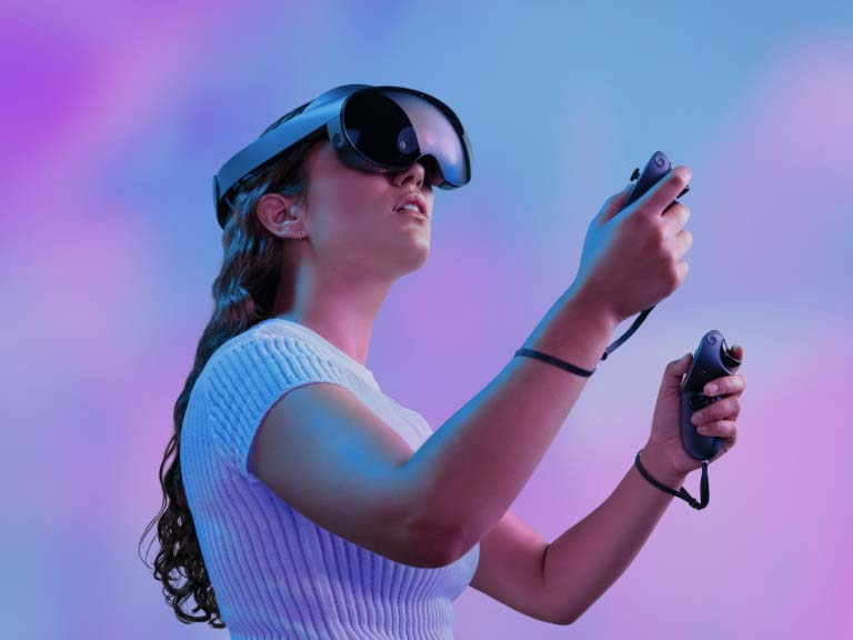 woman in white shirt using a virtual reality headset